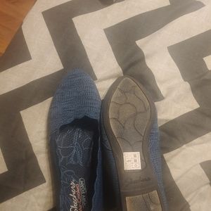 Blue cloth skechers shoes